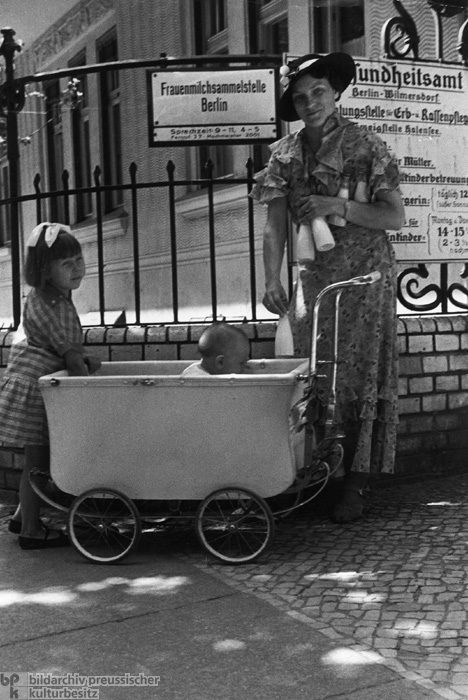 Woman with Two Children in Front of the Breast Milk Collection Site of the Health Office in Berlin-Wilmersdorf (1936)